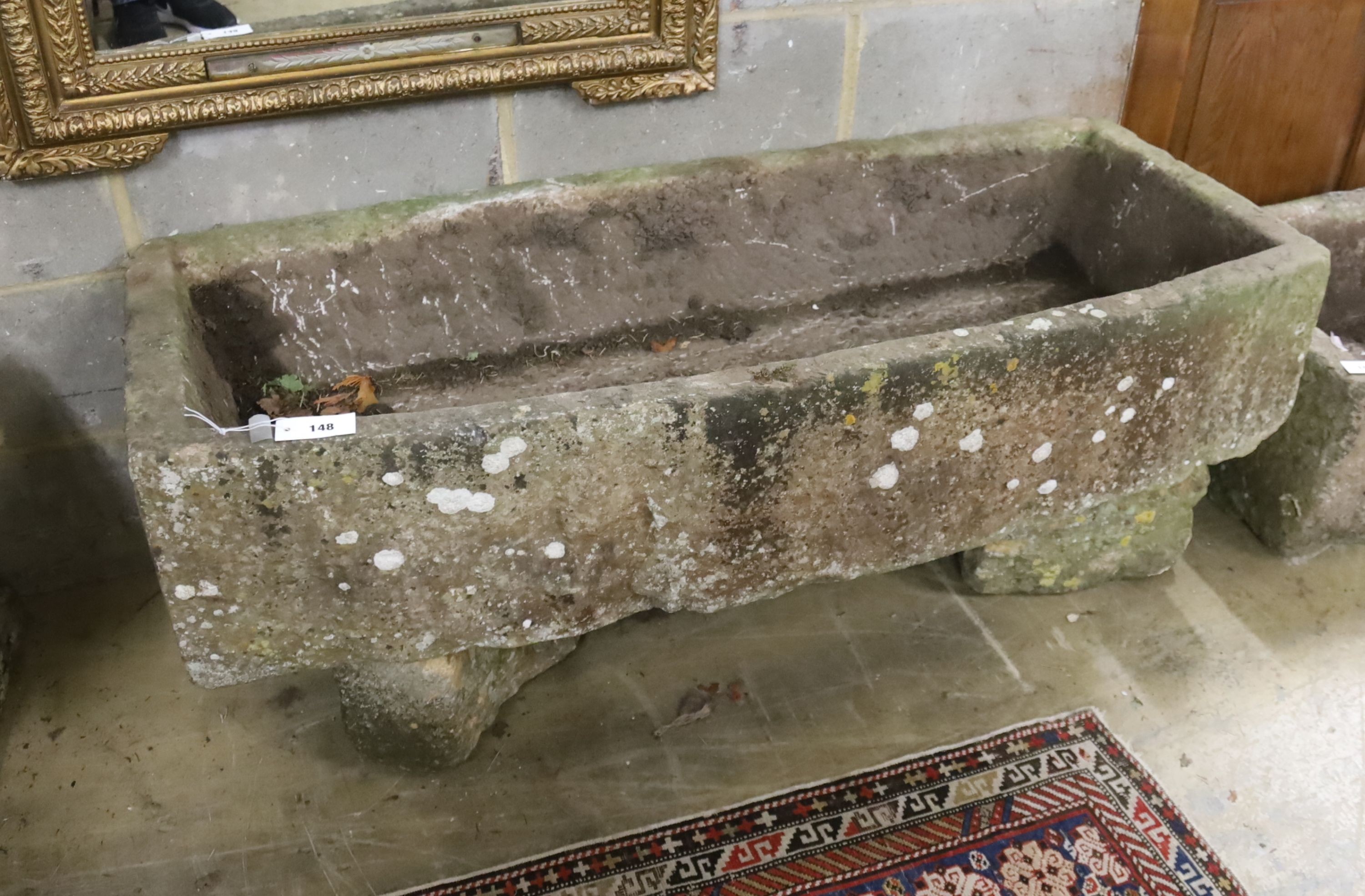 A 19th century carved stone bow fronted trough, length 133cm, depth 57cm, height 54cm